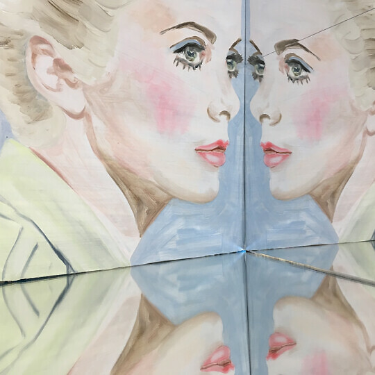 Painting of an actress reflected in a mirror.