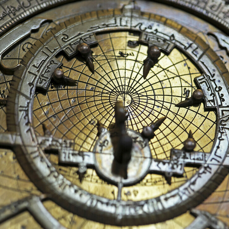 Islamic astrolabe, a measuring instrument with engraved lines and dials.