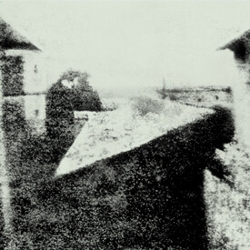 The earliest photograph showing a person on a rooftop..