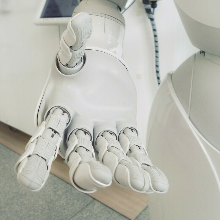A robot's hand reachers out.