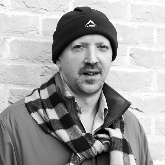 Tom Angier in a hat and scarf.