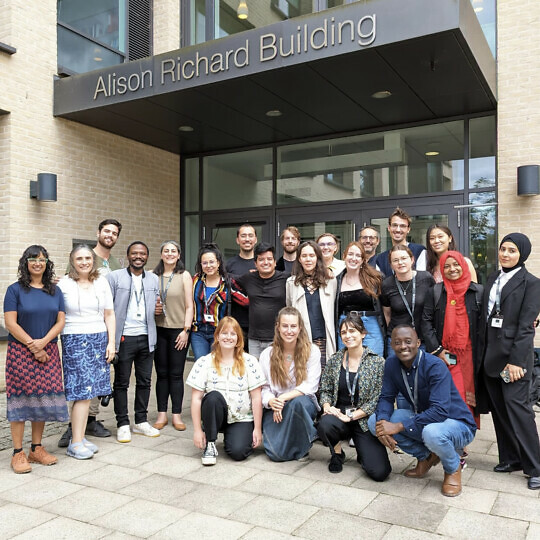 Summer School participants posing for a group photo outside of the Alison Richard Building.