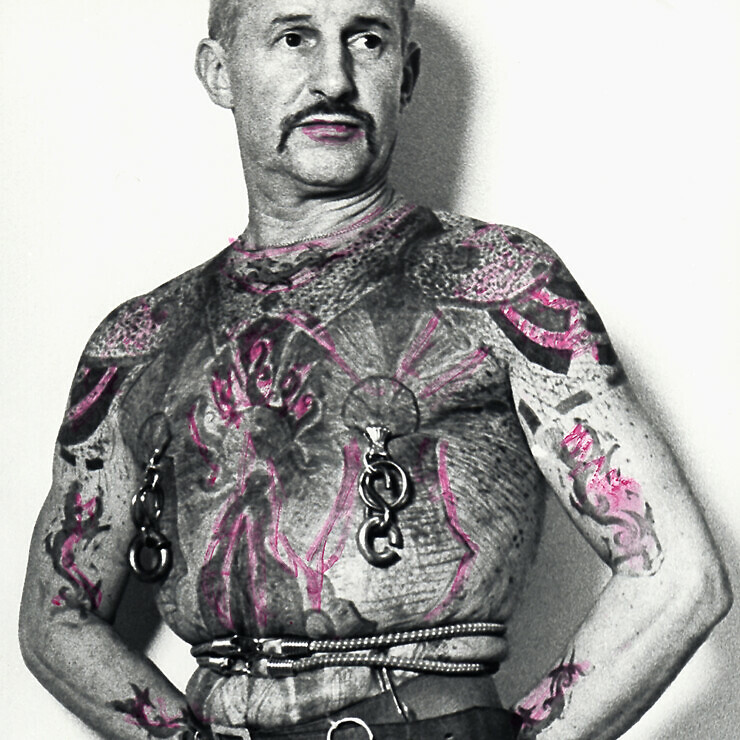 Self-portrait by Albrecht Becker, showing tattoos and piercings.